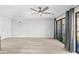 Inviting living room with a ceiling fan and sliding glass doors to the outside at 3700 Golf Colony Lane # 18-G, Little River, SC 29566