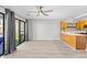 Open-concept living space featuring sliding glass doors and a breakfast bar at 3700 Golf Colony Lane # 18-G, Little River, SC 29566