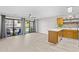 Open-concept living area featuring natural light, balcony access, ceiling fan, and wood flooring at 3700 Golf Colony Lane # 18-G, Little River, SC 29566
