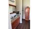 Bathroom featuring a double vanity with granite countertops, stained wood cabinets, and storage at 388 Carriage Lake Dr., Little River, SC 29566