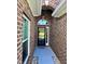 Welcoming entryway with brick accents and a view of the front yard at 388 Carriage Lake Dr., Little River, SC 29566
