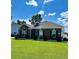 Well-maintained brick home featuring lush green lawn and manicured landscaping at 388 Carriage Lake Dr., Little River, SC 29566