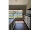 Main bedroom with beautiful view of lake, wood floors, and natural light at 388 Carriage Lake Dr., Little River, SC 29566
