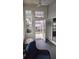 Well-lit porch with tile flooring, comfortable seating, and backyard access at 388 Carriage Lake Dr., Little River, SC 29566