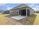 Backyard view showcasing the patio and green siding at 4010 Macks Rd, Aynor, SC 29511