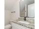 Bathroom featuring a granite vanity, white cabinets, and a vanity mirror at 4010 Macks Rd, Aynor, SC 29511