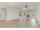 Bright living room with a fireplace, light wood floors, and recessed lighting at 4010 Macks Rd, Aynor, SC 29511