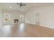 Bright living room with a fireplace, light wood floors, and recessed lighting at 4010 Macks Rd, Aynor, SC 29511