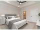 Comfortable main bedroom features a plush bed, stylish lamps, and an ensuite bathroom at 4010 Macks Rd, Aynor, SC 29511