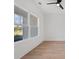 Well lit bedroom with a large window and light wood flooring and a ceiling fan at 4016 Macks Rd, Aynor, SC 29511