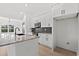 Open kitchen design with island, granite countertops, and white cabinets, blending style and function at 4016 Macks Rd, Aynor, SC 29511