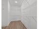 Spacious walk-in closet equipped with multiple shelving units and ample storage capacity at 4016 Macks Rd, Aynor, SC 29511