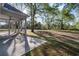 Covered back patio with an unobstructed view of the green field, blending indoor/outdoor living at 4022 Macks Rd, Aynor, SC 29511