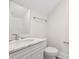 Bright bathroom featuring marble countertop vanity and a toilet, along with a shower at 4022 Macks Rd, Aynor, SC 29511
