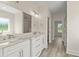 Bright bathroom featuring double sink vanity with marble countertop and walk-in shower at 4022 Macks Rd, Aynor, SC 29511