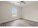 Bright bedroom with ceiling fan and one window providing abundant natural light at 4022 Macks Rd, Aynor, SC 29511