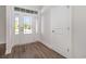 Bright foyer with a glass-paneled front door and wood-look flooring at 4022 Macks Rd, Aynor, SC 29511