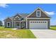 Charming home featuring a manicured lawn, and a two-car garage, enhancing its curb appeal at 4022 Macks Rd, Aynor, SC 29511