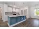 This kitchen offers white cabinets, a marble counter top, tile back splash, and stainless steel appliances at 4022 Macks Rd, Aynor, SC 29511