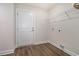 Laundry room featuring new floors, wire shelf and a door to the outside at 4022 Macks Rd, Aynor, SC 29511
