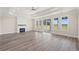 Bright living room features fireplace, hardwood floors, tray ceiling, and access to the backyard at 4022 Macks Rd, Aynor, SC 29511