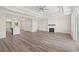 Spacious living room featuring tray ceiling, fireplace, hardwood floors, and an abundance of natural light at 4022 Macks Rd, Aynor, SC 29511