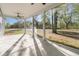 Enjoy the outdoors from this screened-in porch with ceiling fans and views of the expansive backyard at 4022 Macks Rd, Aynor, SC 29511