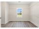 Bright walk-in closet features a window with a view and adjustable shelving units perfect for organization at 4022 Macks Rd, Aynor, SC 29511