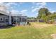 Green backyard features an enclosed in-ground swimming pool at 403 Brandymill Blvd, Myrtle Beach, SC 29588