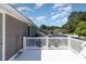 White balcony with views overlooking the neighborhood and an enclosed in-ground pool at 403 Brandymill Blvd, Myrtle Beach, SC 29588