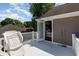A nice outdoor balcony features white railings and furniture, with an open door leading into an indoor bedroom at 403 Brandymill Blvd, Myrtle Beach, SC 29588