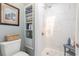 Bright bathroom featuring white marble tile in the shower and sleek shelving unit at 403 Brandymill Blvd, Myrtle Beach, SC 29588