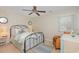 Airy bedroom features sleek bed, a ceiling fan and a bright window for natural light at 403 Brandymill Blvd, Myrtle Beach, SC 29588