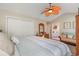 Cozy bedroom featuring a large bed, a ceiling fan, and good natural light at 403 Brandymill Blvd, Myrtle Beach, SC 29588