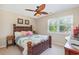 Comfortable bedroom features a bed with ornate headboard and attractive ceiling fan at 403 Brandymill Blvd, Myrtle Beach, SC 29588