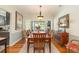 Bright dining room featuring a wood table, seating for eight, and sliding glass doors at 403 Brandymill Blvd, Myrtle Beach, SC 29588
