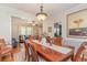 This dining room features a wood table, seating for six, and wainscotting at 403 Brandymill Blvd, Myrtle Beach, SC 29588