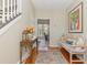 Inviting foyer with hardwood floors, bench, and decorative table, flowing into adjacent living spaces at 403 Brandymill Blvd, Myrtle Beach, SC 29588