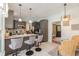 A kitchen with a breakfast bar that offers seating, stainless appliances, and gray shaker cabinets at 403 Brandymill Blvd, Myrtle Beach, SC 29588