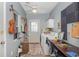 Functional laundry room with washer, dryer, and guitars hung decoratively on the wall at 403 Brandymill Blvd, Myrtle Beach, SC 29588