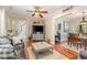 Cozy living room featuring hardwood floors, a fireplace, and an open transition to the dining area at 403 Brandymill Blvd, Myrtle Beach, SC 29588