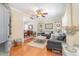 Comfortable living room with hardwood floors, neutral decor, and an open view to the dining area at 403 Brandymill Blvd, Myrtle Beach, SC 29588