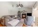 Spacious living room with a cozy fireplace, neutral tones, and ample seating for relaxation at 403 Brandymill Blvd, Myrtle Beach, SC 29588