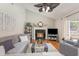 Bright living room with a fireplace, high ceiling and access to the backyard through sliding glass doors at 403 Brandymill Blvd, Myrtle Beach, SC 29588
