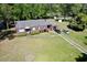Aerial view of a brick home with lush green lawn and two-car driveway at 408 South Farr Ave., Andrews, SC 29510