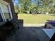 Spacious backyard with a grill, large trees, and well-maintained lawn at 408 South Farr Ave., Andrews, SC 29510