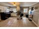 Functional kitchen with white cabinets, black appliances, and a breakfast bar island, offering ample space and great lighting at 408 South Farr Ave., Andrews, SC 29510