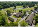 Stunning aerial view of the clubhouse in a pristine golf course community surrounded by lush greenery at 414 Staghorn Ln., Longs, SC 29568