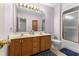Bathroom with dual sinks and a combined shower and tub at 414 Staghorn Ln., Longs, SC 29568