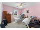 Bedroom featuring pink walls, a window view and eclectic decor at 414 Staghorn Ln., Longs, SC 29568